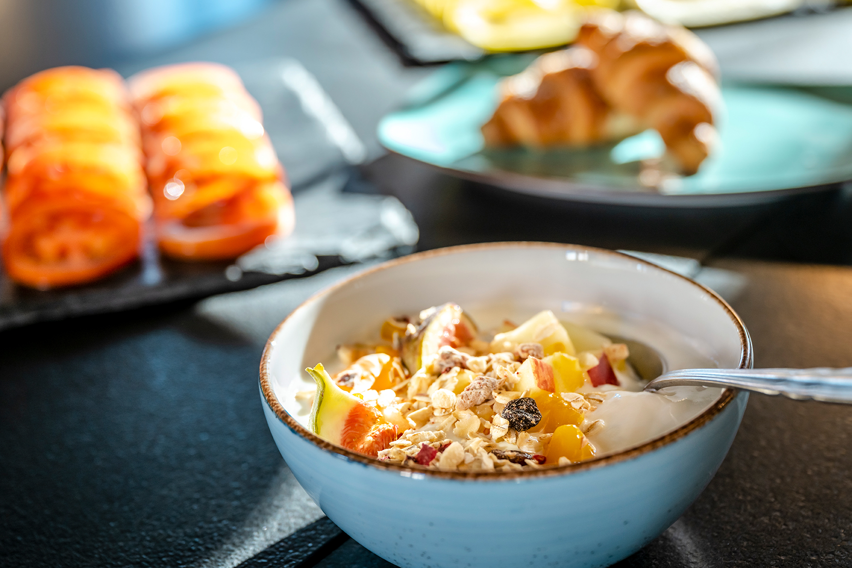 Cereal bowl , tomatoes and croissant at breakfast buffet kloster seeon